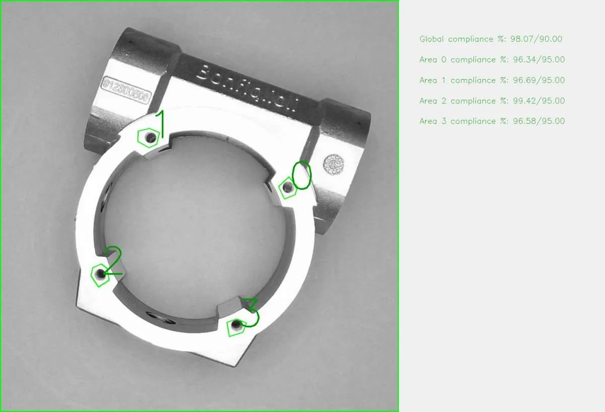 Metal clamp ring with four inspection areas marked and a compliance score per area
